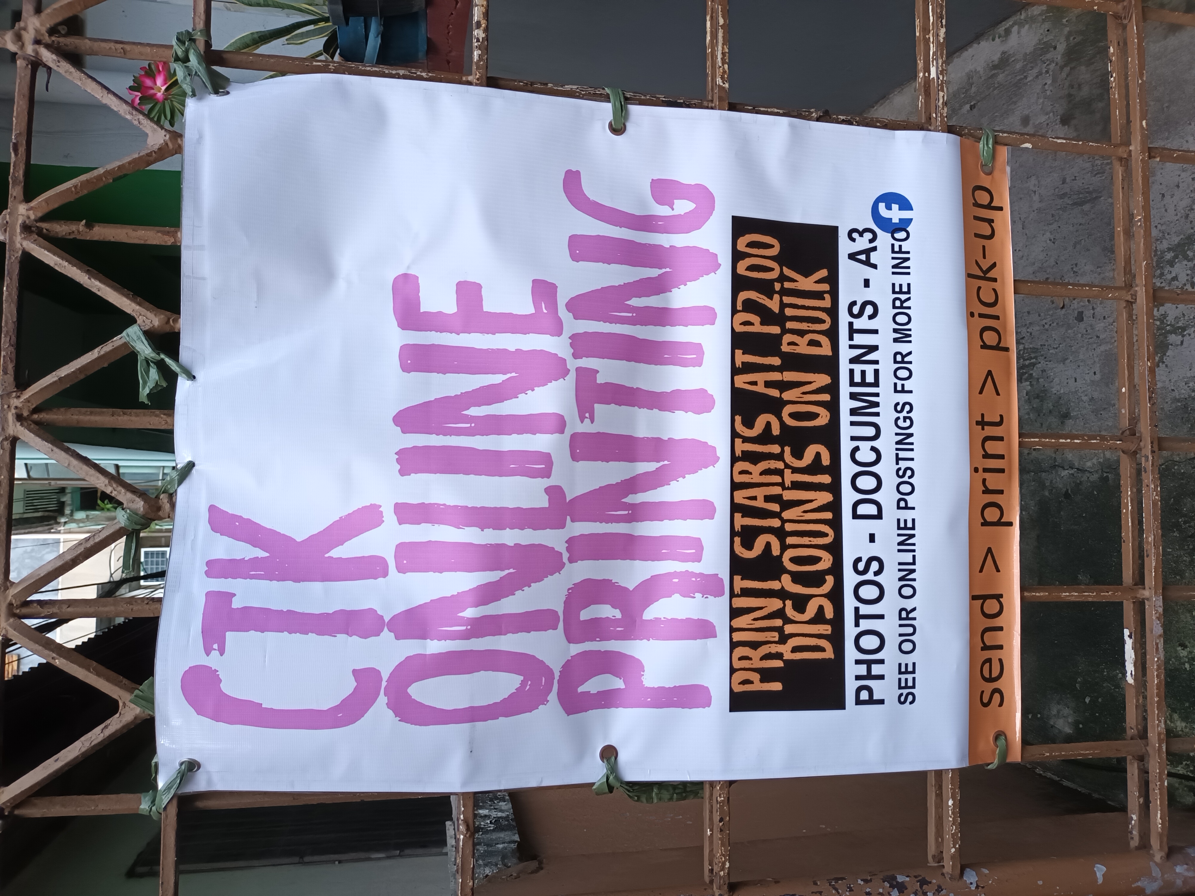 Photo of the CTK Online Printing tarpaulin at their gate