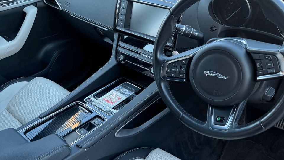 Jaguar interior after full valet — clean centre console and fresh seats