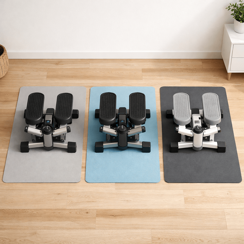 Three compact adjustable mini steppers arranged side by side on a light wood apartment floor