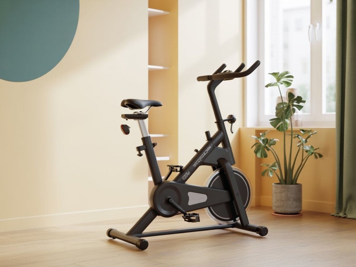 Compact magnetic exercise bike tucked into a small apartment corner with a 40x20 inch footprint.