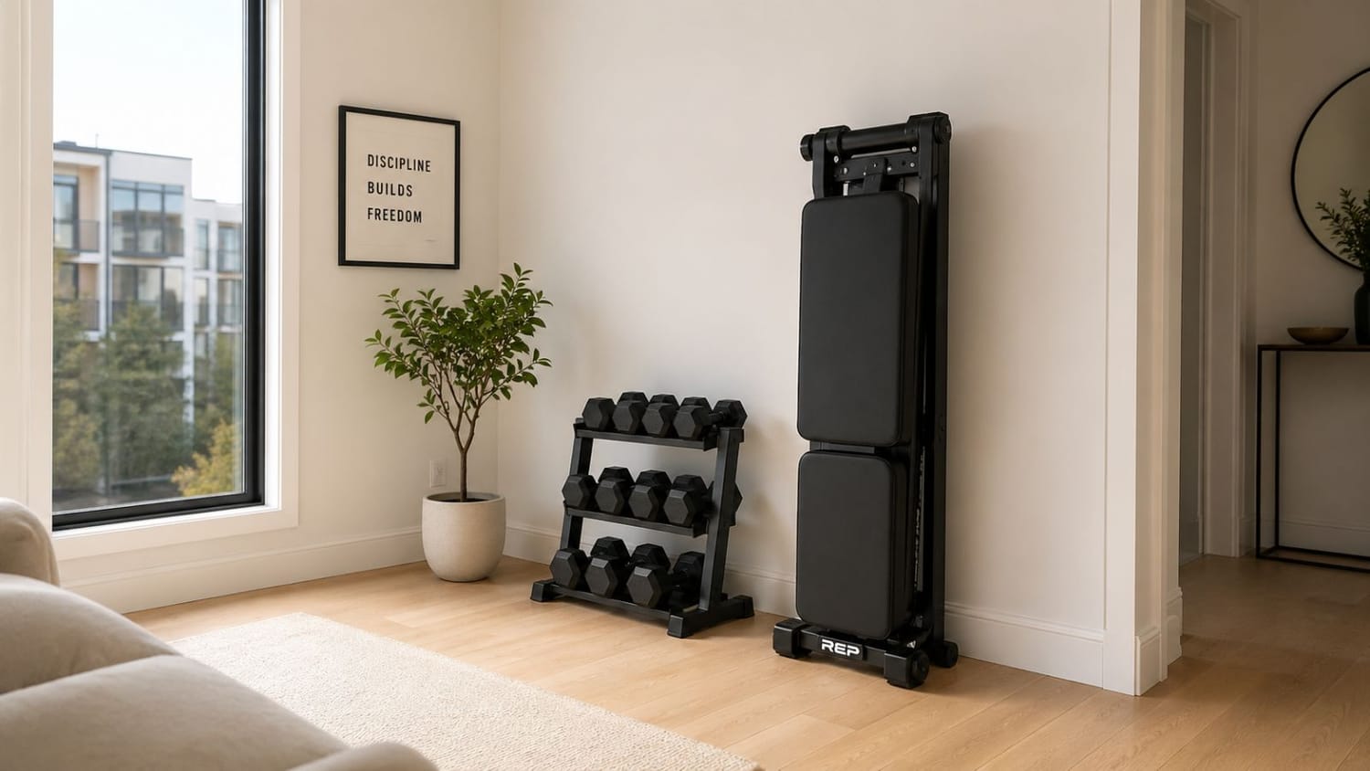 Foldable adjustable weight bench stored vertically in a small apartment home gym corner