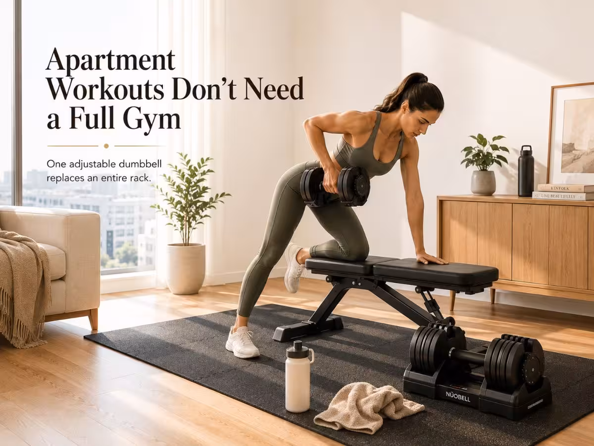 Woman performing a dumbbell row on a foldable bench with adjustable dumbbells in a bright apartment home gym.