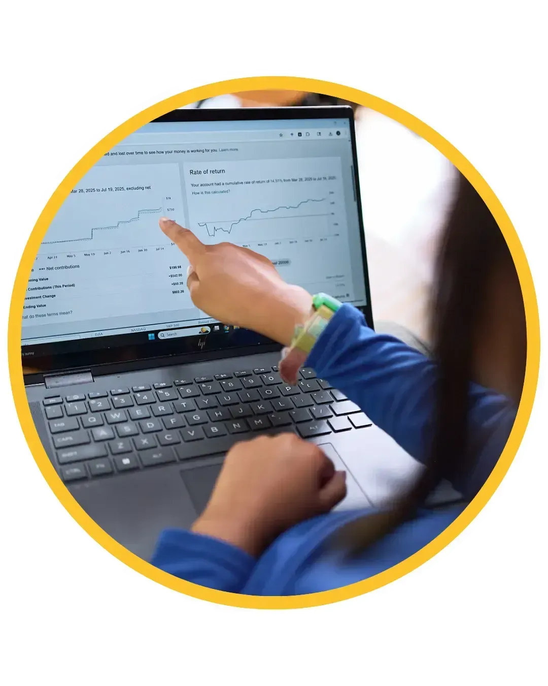 Carys pointing at a graph on her laptop, learning financial literacy and entrepreneurship education skills