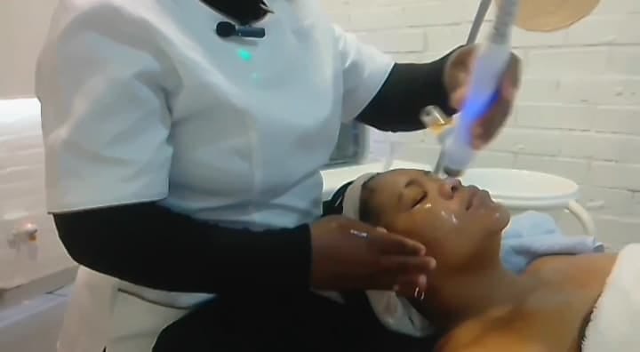 Client receiving a gentle facial tailored for sensitive skin in a calming spa environment