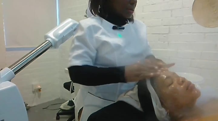 A soothing anti-aging renewal facial in progress, with a professional applying skin-revitalizing products to reduce fine lines, boost collagen, and renew the skin for a youthful, radiant glow.