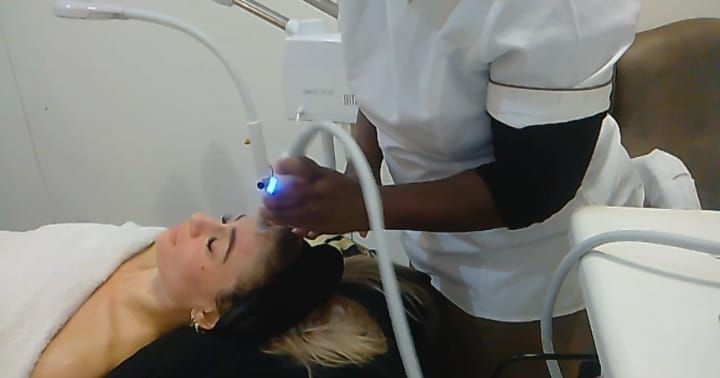 An Oxygen HydraLift Facial in session, showing a professional infusing oxygen and hydrating serums into the skin to lift, firm, and brighten the complexion, promoting a youthful, radiant, and revitalized appearance.