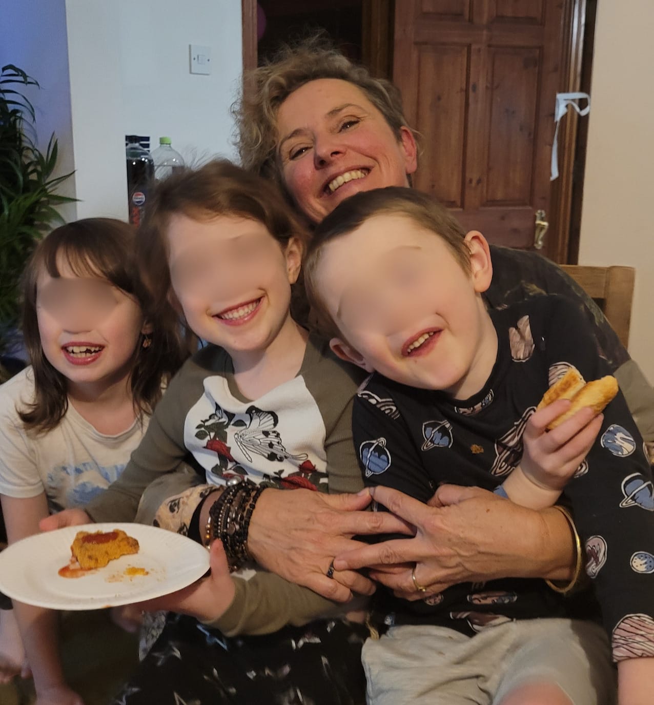 Jenny sharing fun and cuddles with children during a family holiday.