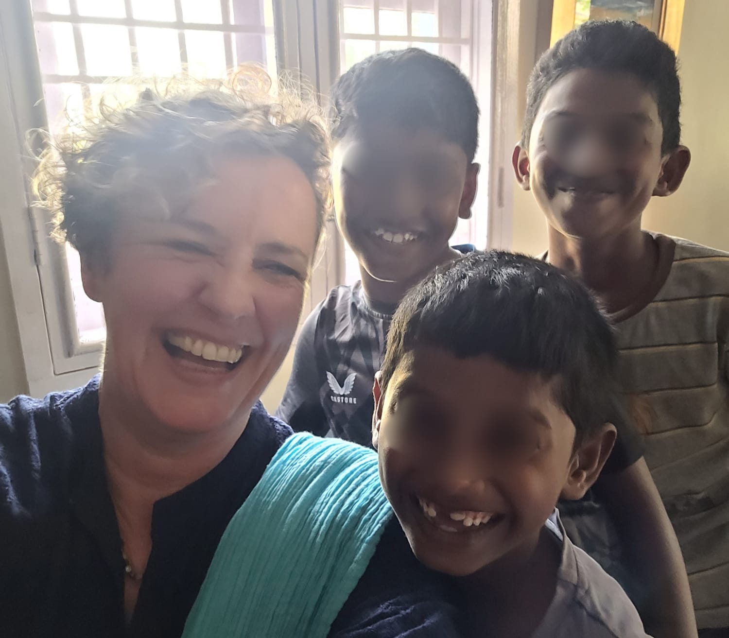 Jenny having holiday fun with 3 young boys.