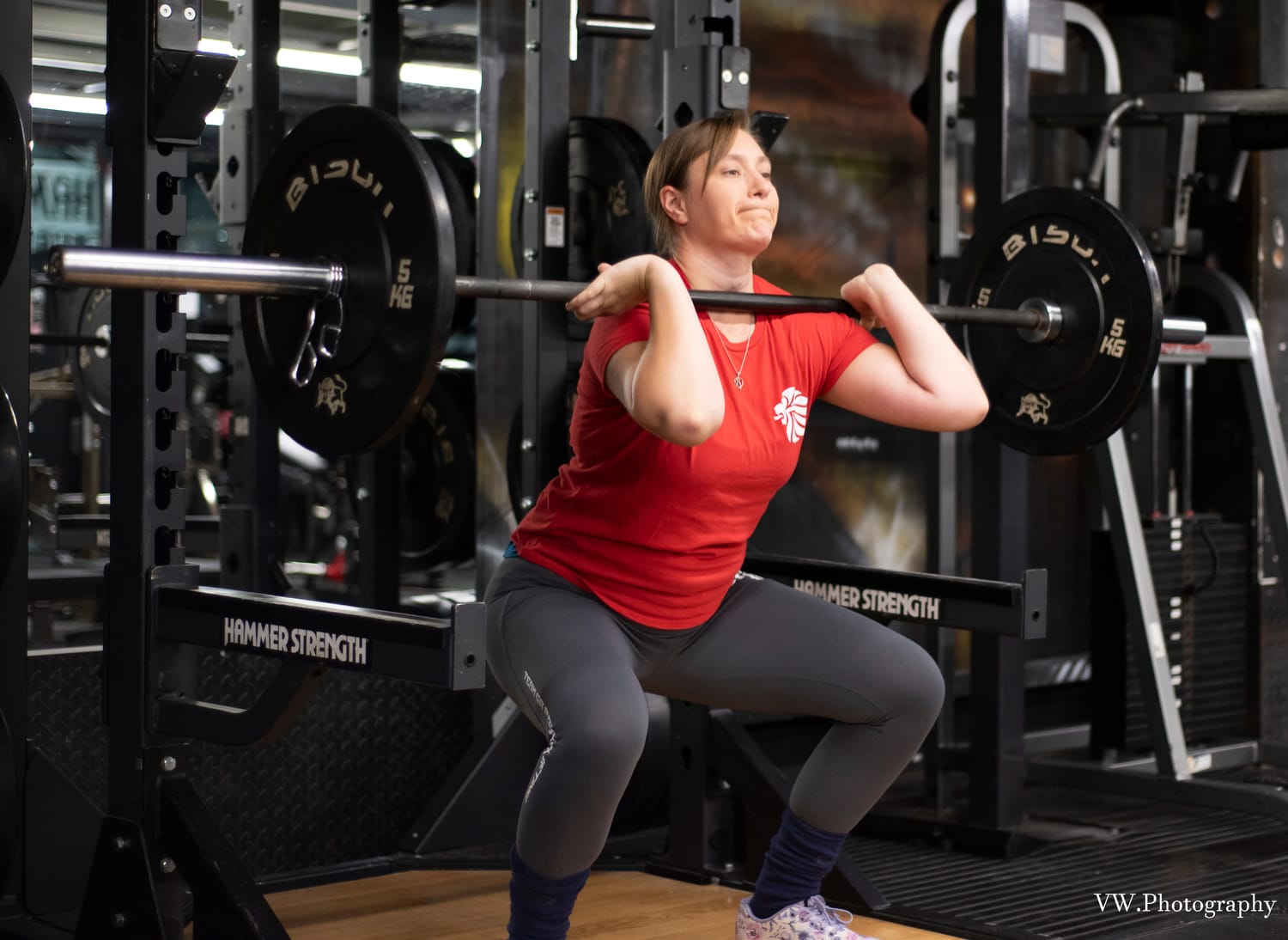 Woman performing a front squat during strength training