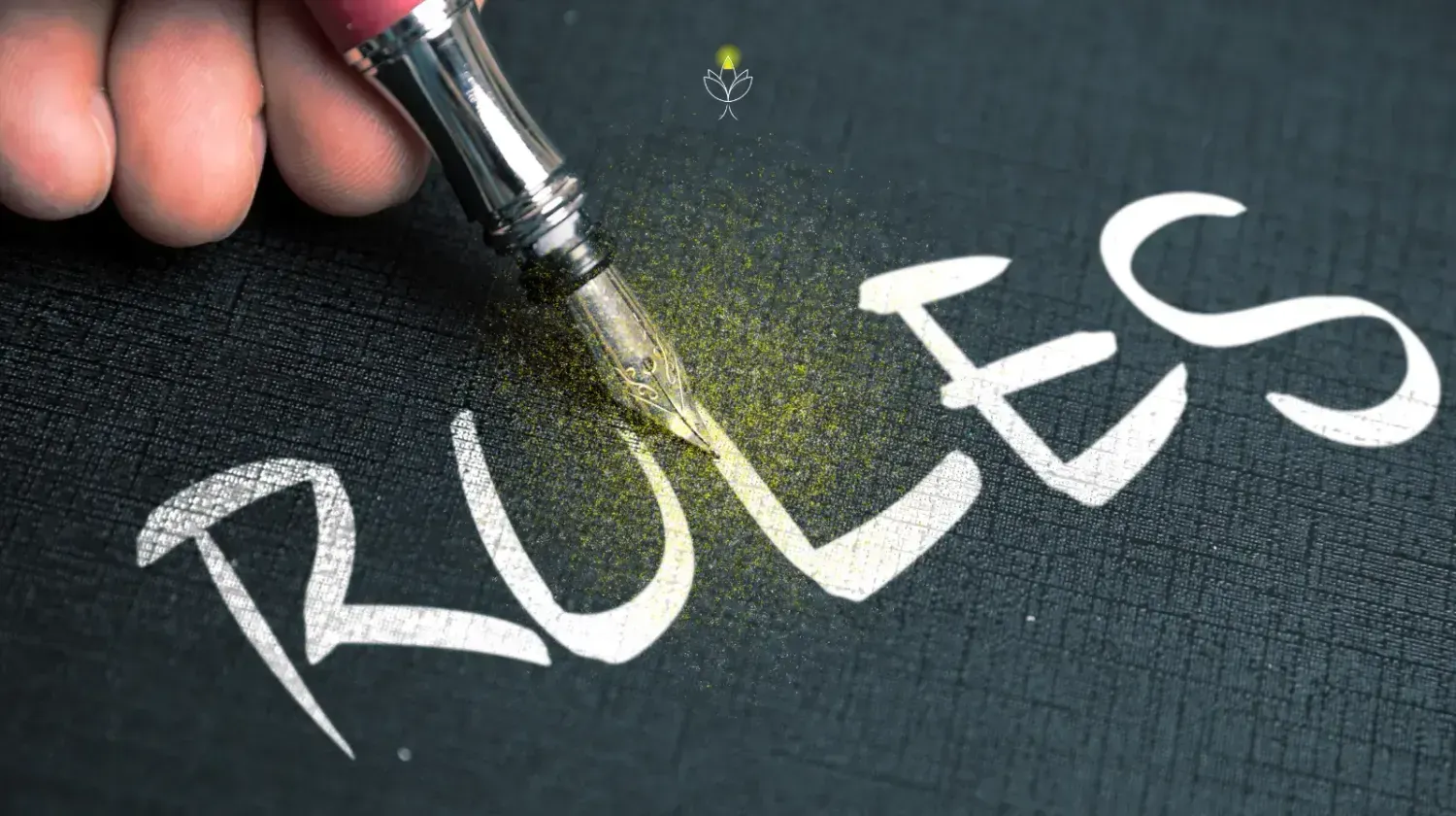 Close-up of a fountain pen writing the word “Rules” with glowing Firefly dust — representing creative website writing principles.