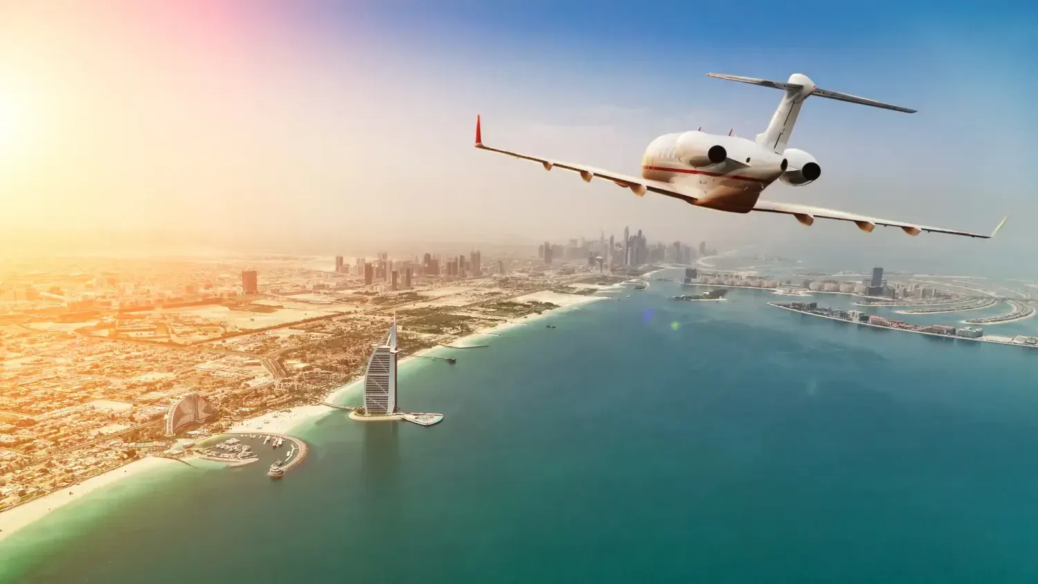 Private jet flying over Dubai with a view of Burj Al Arab and Palm Jumeirah — symbolizing business freedom, travel lifestyle, and the benefits of opening an LLC in the UAE.