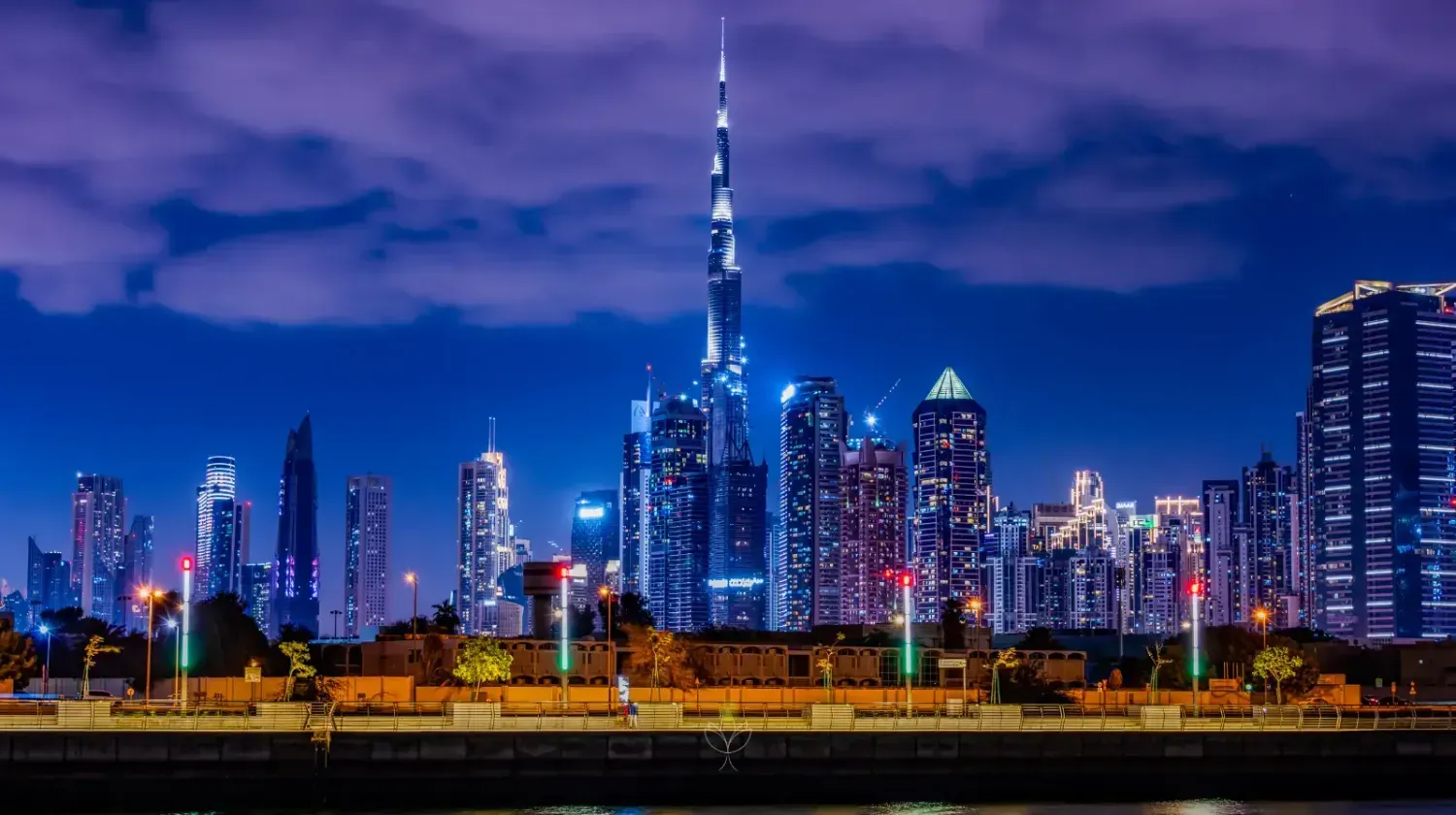 Downtown Dubai skyline at night with Burj Khalifa illuminated – symbolizing the modern business boom and entrepreneurial opportunities.