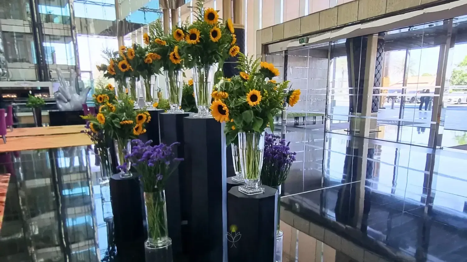 Luxury Maydan hotel lobby in Dubai decorated with sunflowers – reflecting professionalism, elegance, and Free Zone business culture.