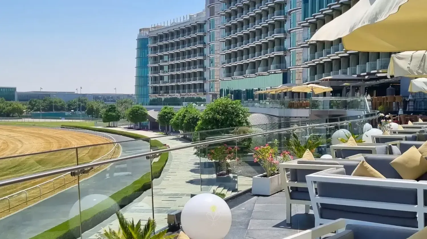 Terrace view of Meydan Hotel overlooking the racecourse in Dubai – representing top UAE Free Zones for entrepreneurs and online businesses.