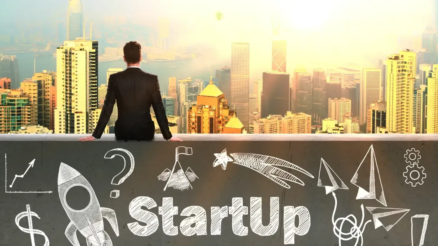 Businessperson looking over a city skyline, symbolizing a fresh start for a new online startup journey