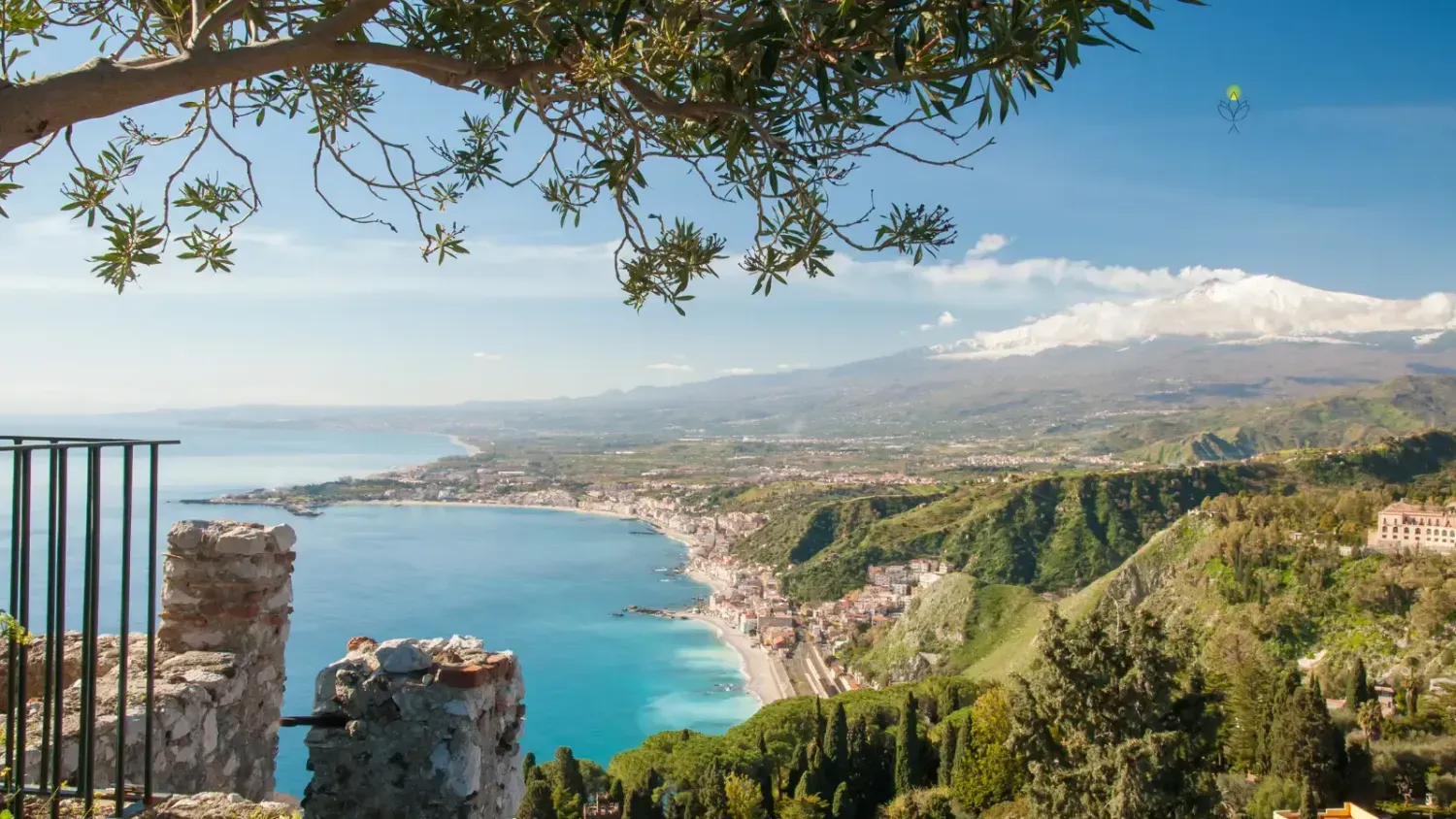 Businessman in a suit pressing a glowing lock icon surrounded by colorful icons for email, files, music and data. NordVPN logo highlights digital security and privacy protection for safe online travel.