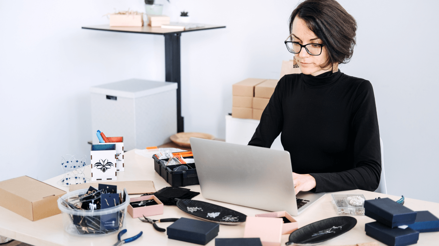 Creative seller preparing products and listings for an Etsy online shop