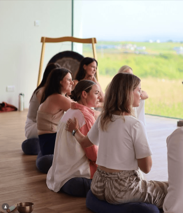 Kerie supporting a group breathwork session