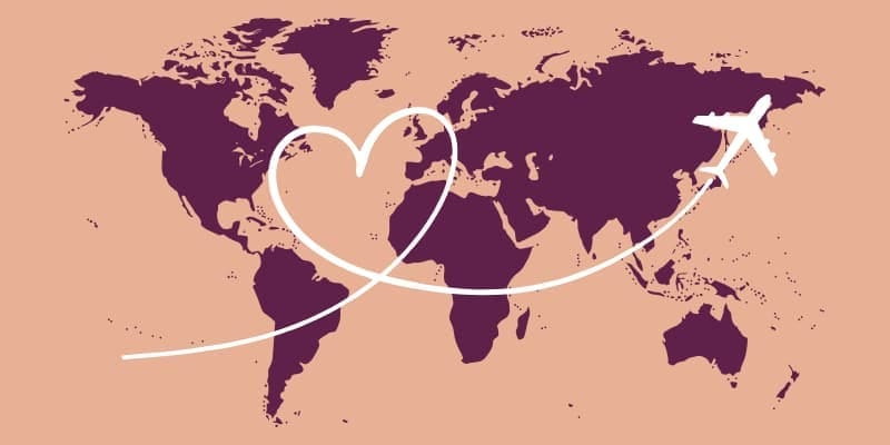 World map background with a heart-shaped flight path from a plane, symbolizing joyful travel, connection, and midlife neurodivergent adventurers.