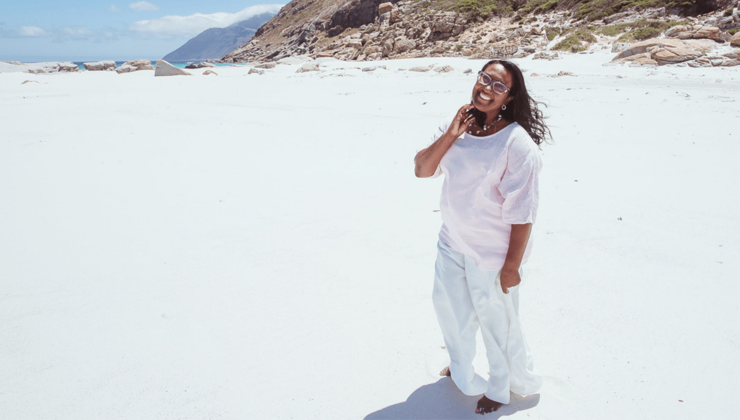 Avril Fortuin joyfully celebrating on the beach