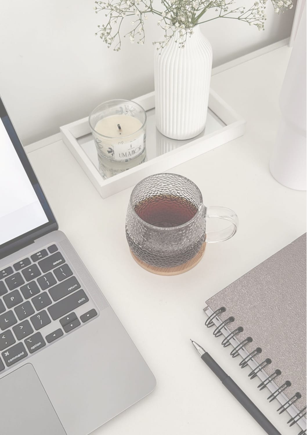 Calm workspace with laptop, tea and notebook