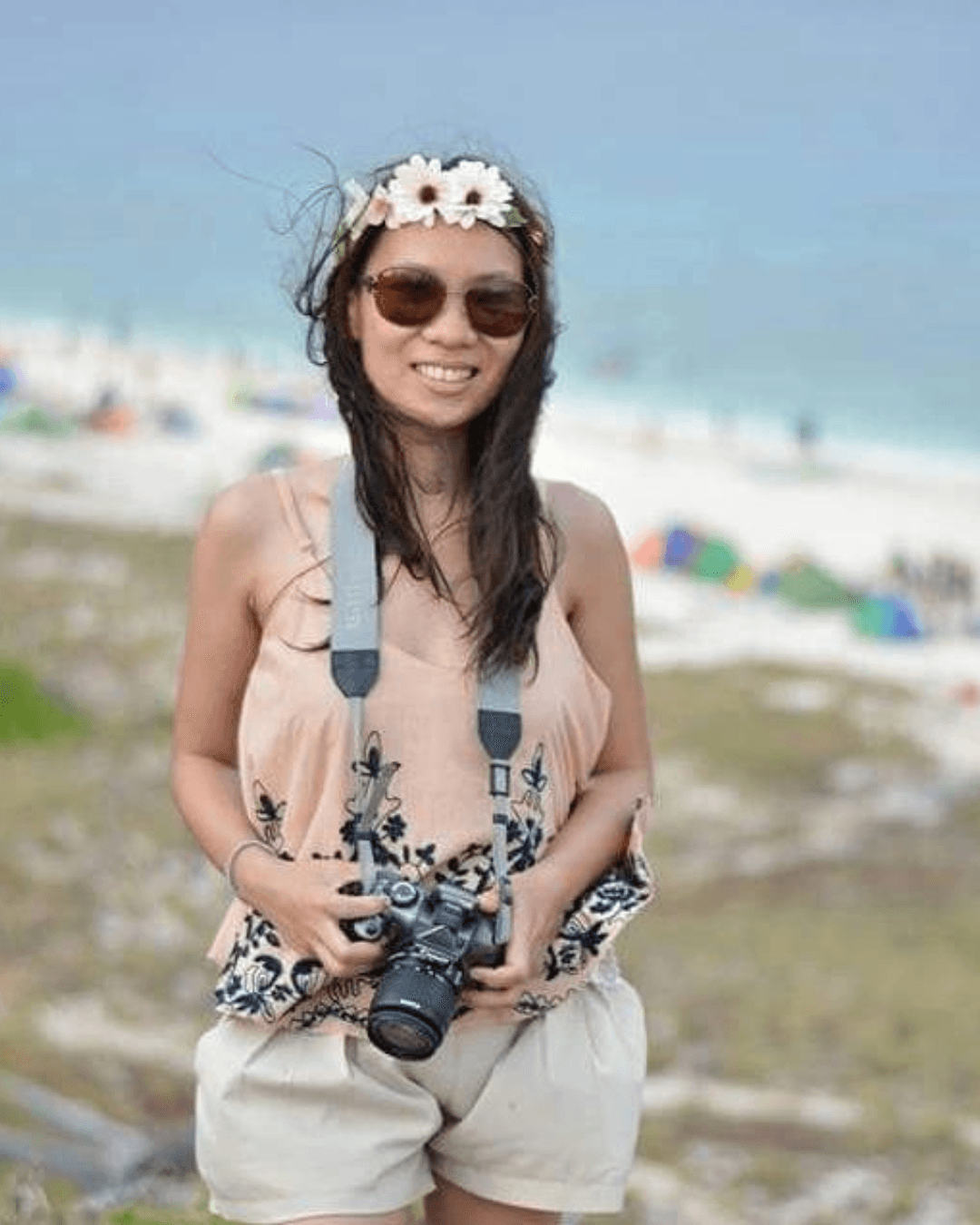 Lorraine Jensen at the beach with camera