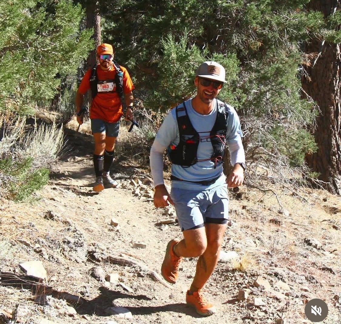 Eric Schroeter pacing one of his athletes toward their first 100-mile finish
