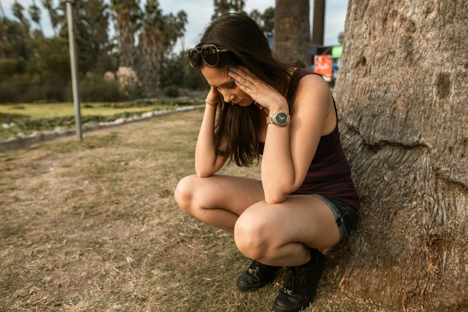 woman with anxiety and her hands on her head