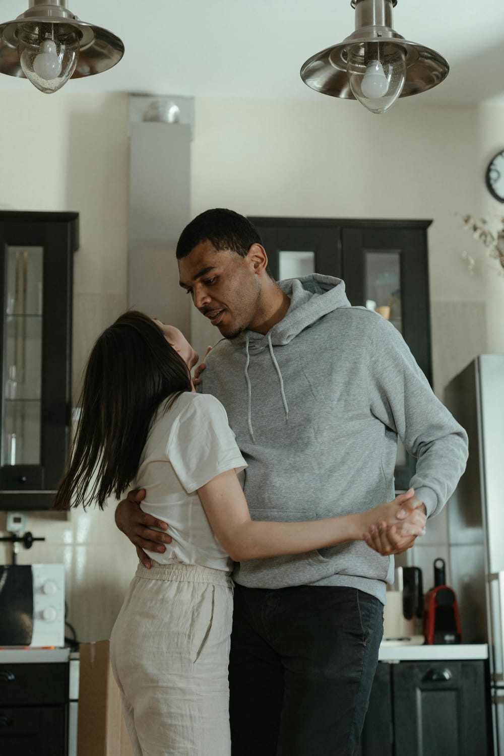 couple dancing in the kitchen