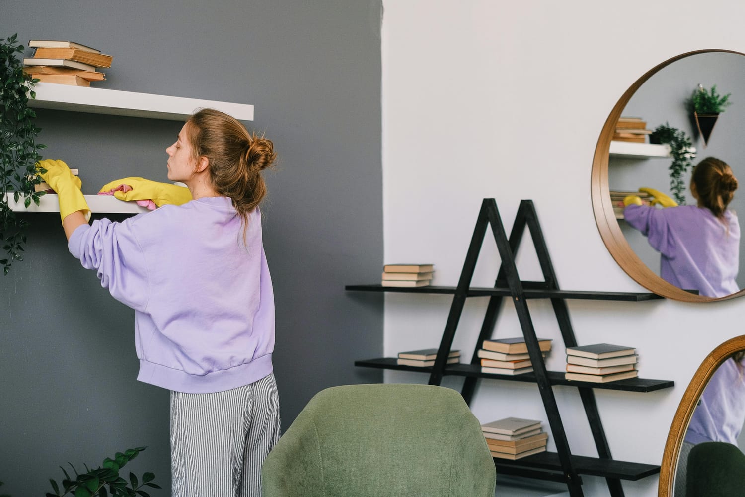 Mom cleaning shelf in living room