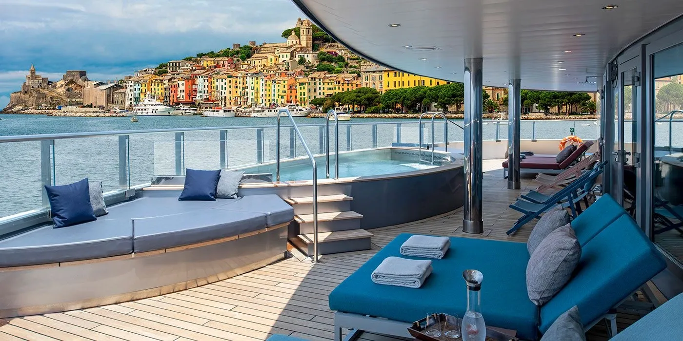 View from Seabourn cruise ship deck of scenic Italian port, destination-focused cruise travel