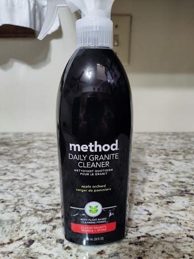 Black refrigerator and wine cooler beside stainless dishwasher