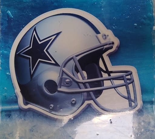 Black refrigerator and wine cooler beside stainless dishwasher