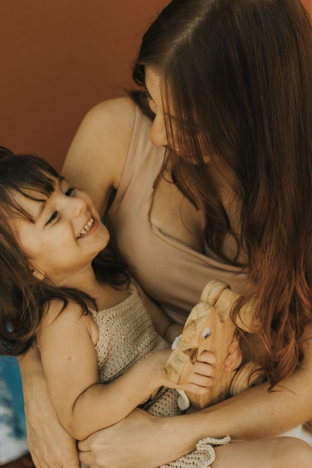 Mom and toddler cuddling