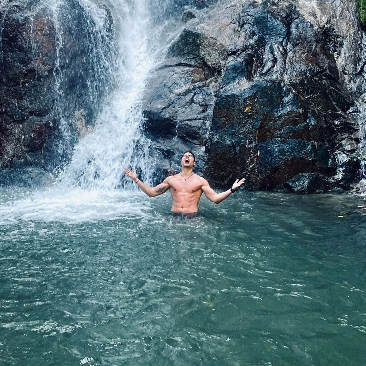 François de Neuville in a waterfall