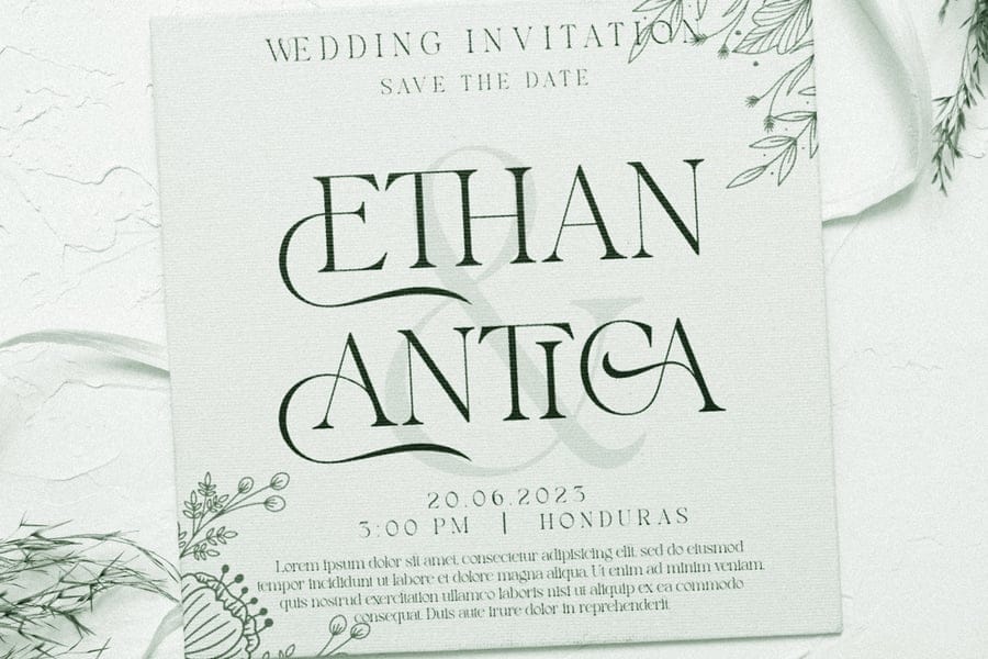 Elegant textured canvas wedding invitation template for Ethan and Antica showcasing romantic display typography, intricate ligatures, and minimalist botanical line art drawings.