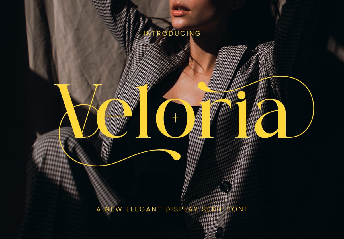 Veloria elegant display serif font introduction cover banner featuring bold yellow title typography overlaying a model wearing a houndstooth blazer suit.