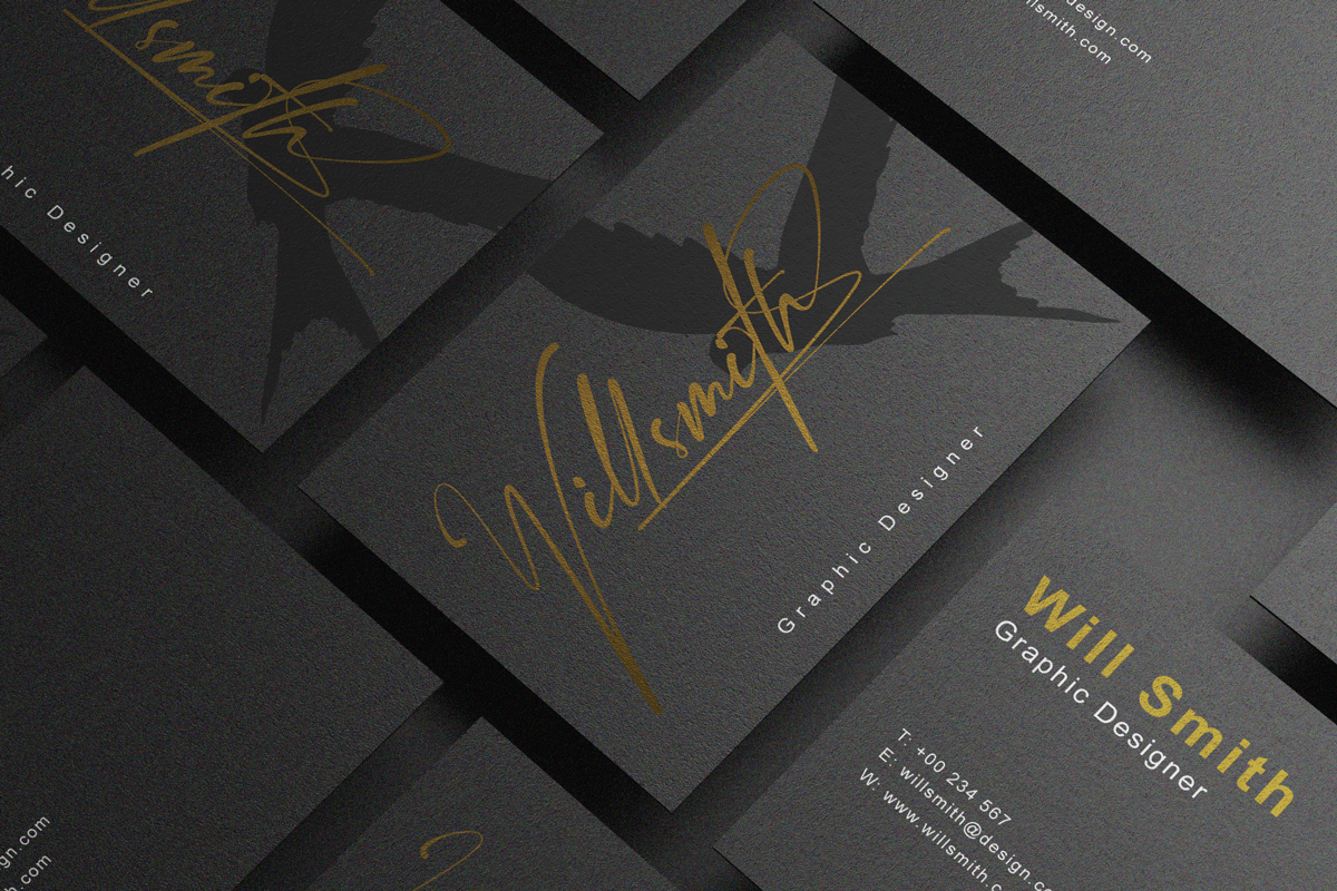 Signature script font in gold foil on a graphic designer's business card