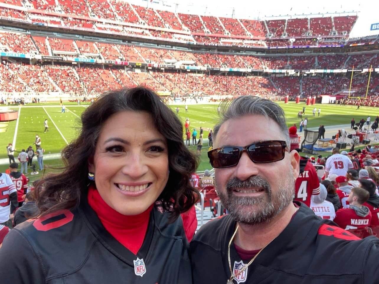 Chris Daniel and Wife at a Football Game - Team Spirit