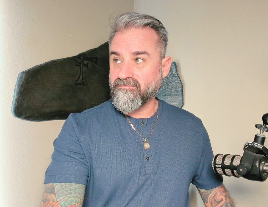 Chris Daniel - and image of Chris editing a podcast or video