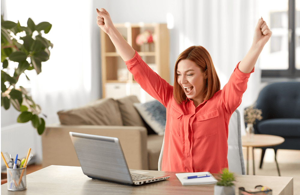 Happy woman working on computer
