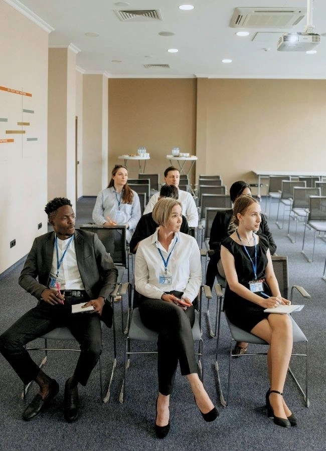 conference audience looking at speaker