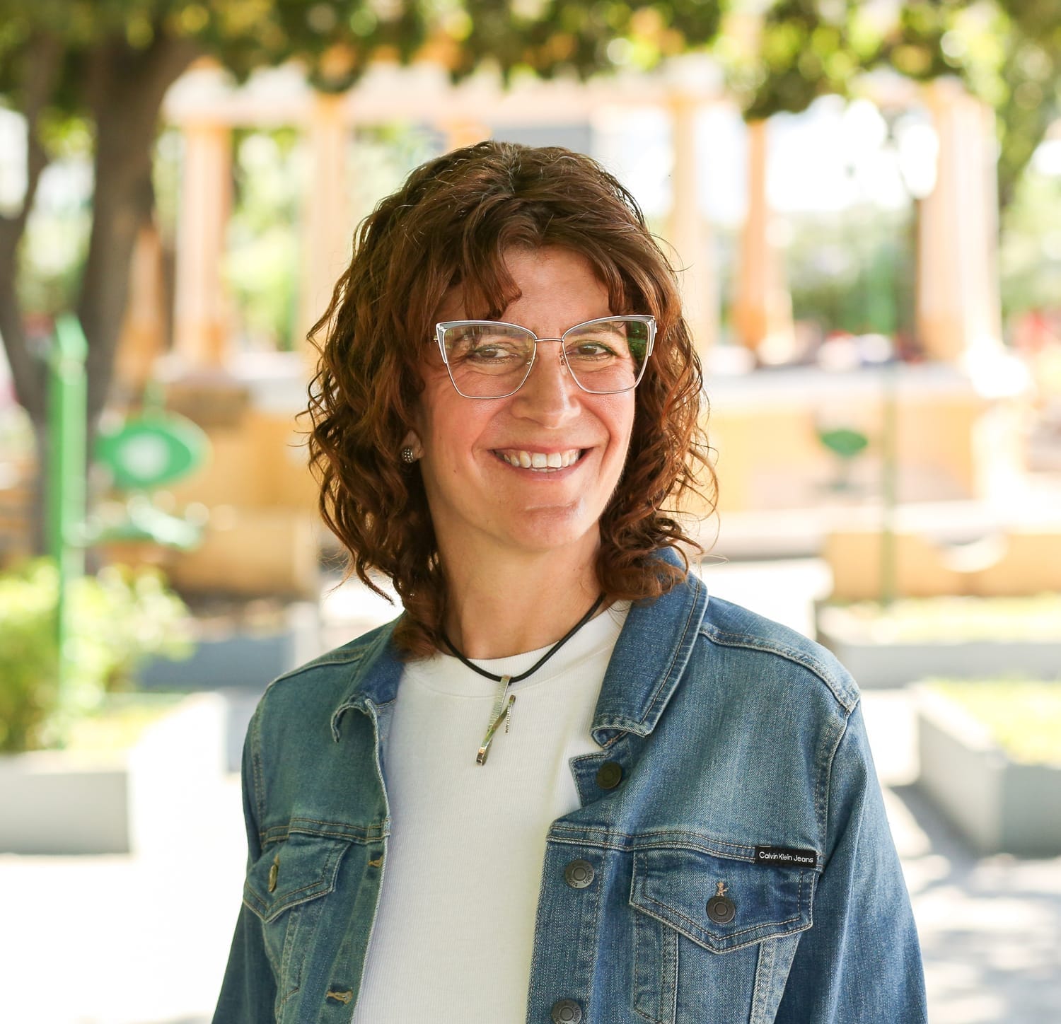 Founder Kristen Crisp wearing a denim jacket and white tshirt 