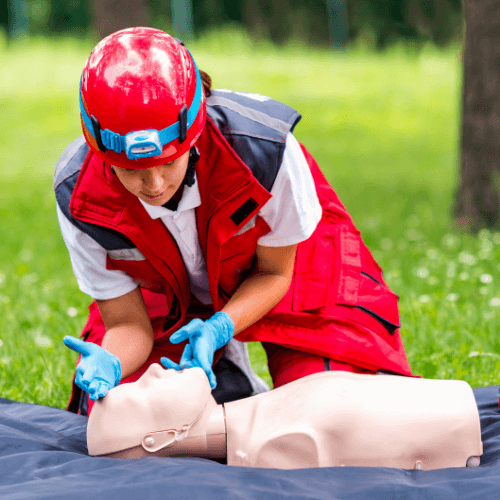 Paramedic demonstrating first aid