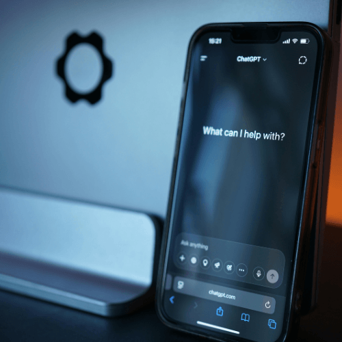 A smartphone screen showing the ChatGPT interface, symbolizing AI literacy and training for entrepreneurs to embrace new technology.