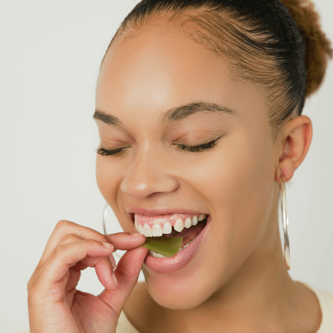 lady putting ODF oral dissolving film under her tongue 