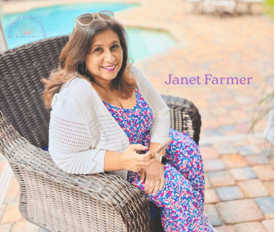 janet farmer, women's business coach sitting by the pool holding her cell phone