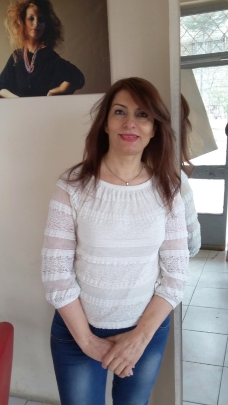 After weight loss transformation, woman in white top smiling