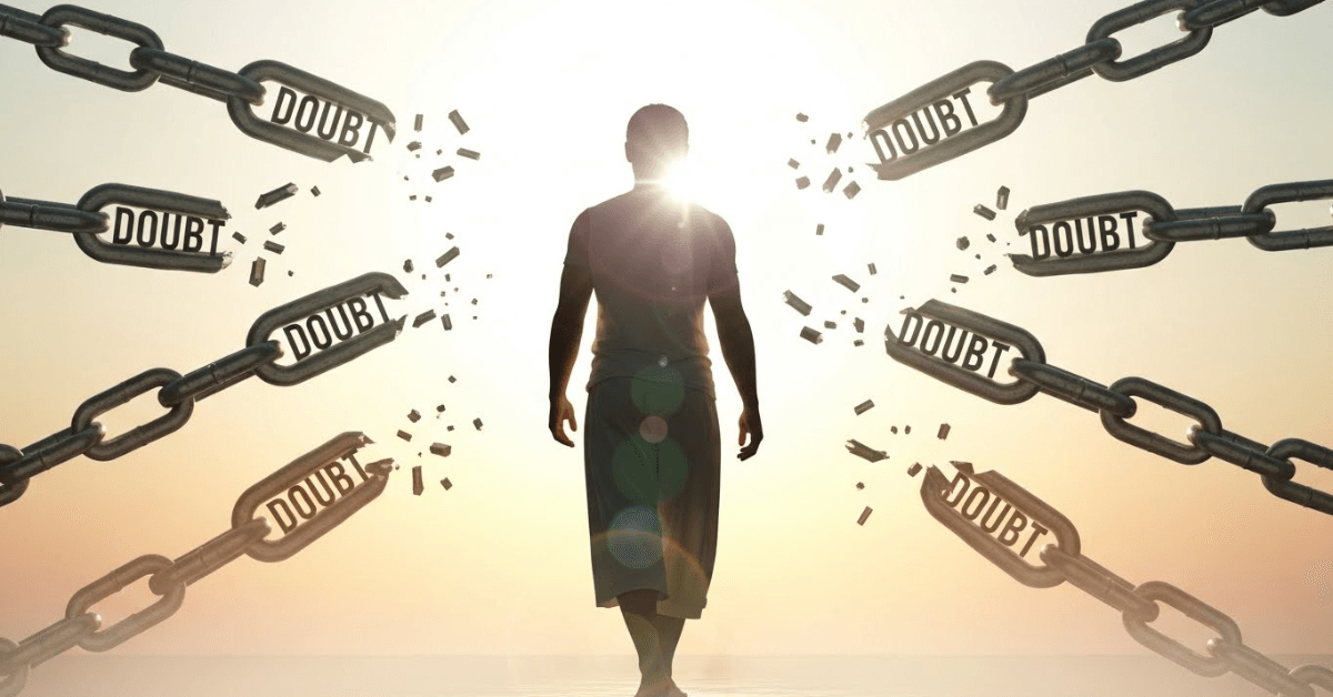 A symbolic image of a person walking forward into bright light as chains labeled “Doubt” shatter behind them, representing freedom from self-doubt and the decision to pursue dreams with confidence.