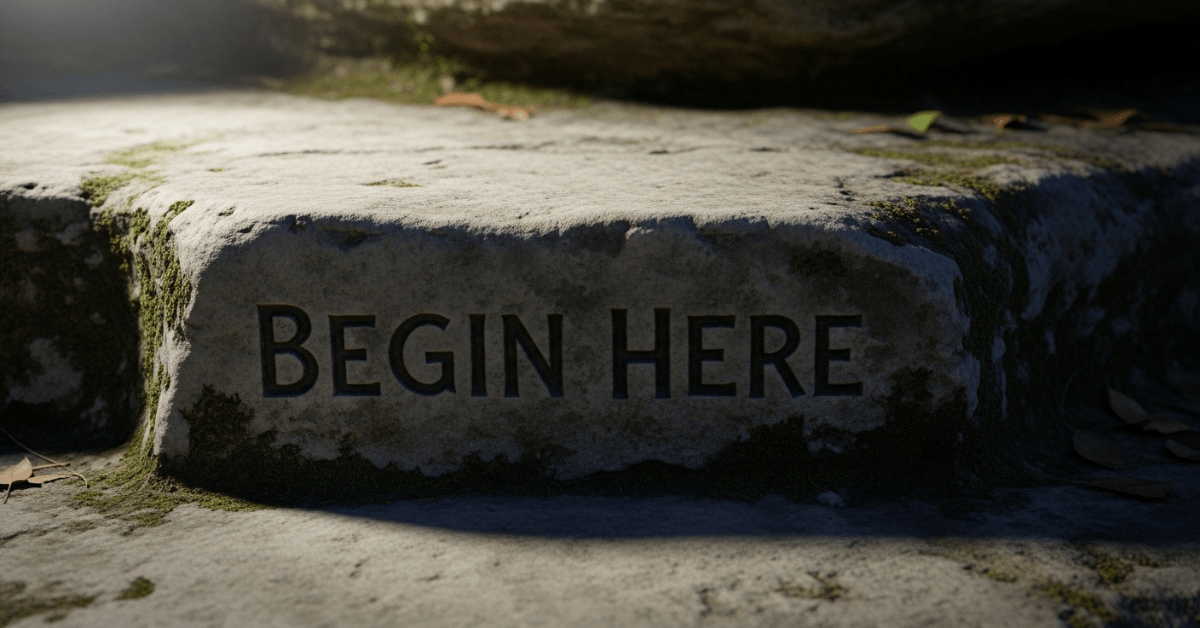 Stone step engraved with the words ‘Begin Here,’ symbolizing taking the first step toward change and ending excuses.